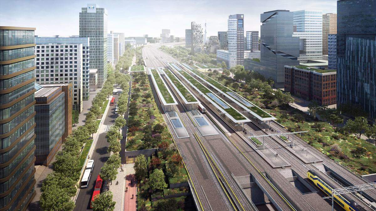 Moderne stad met treinstation en groene omgeving.